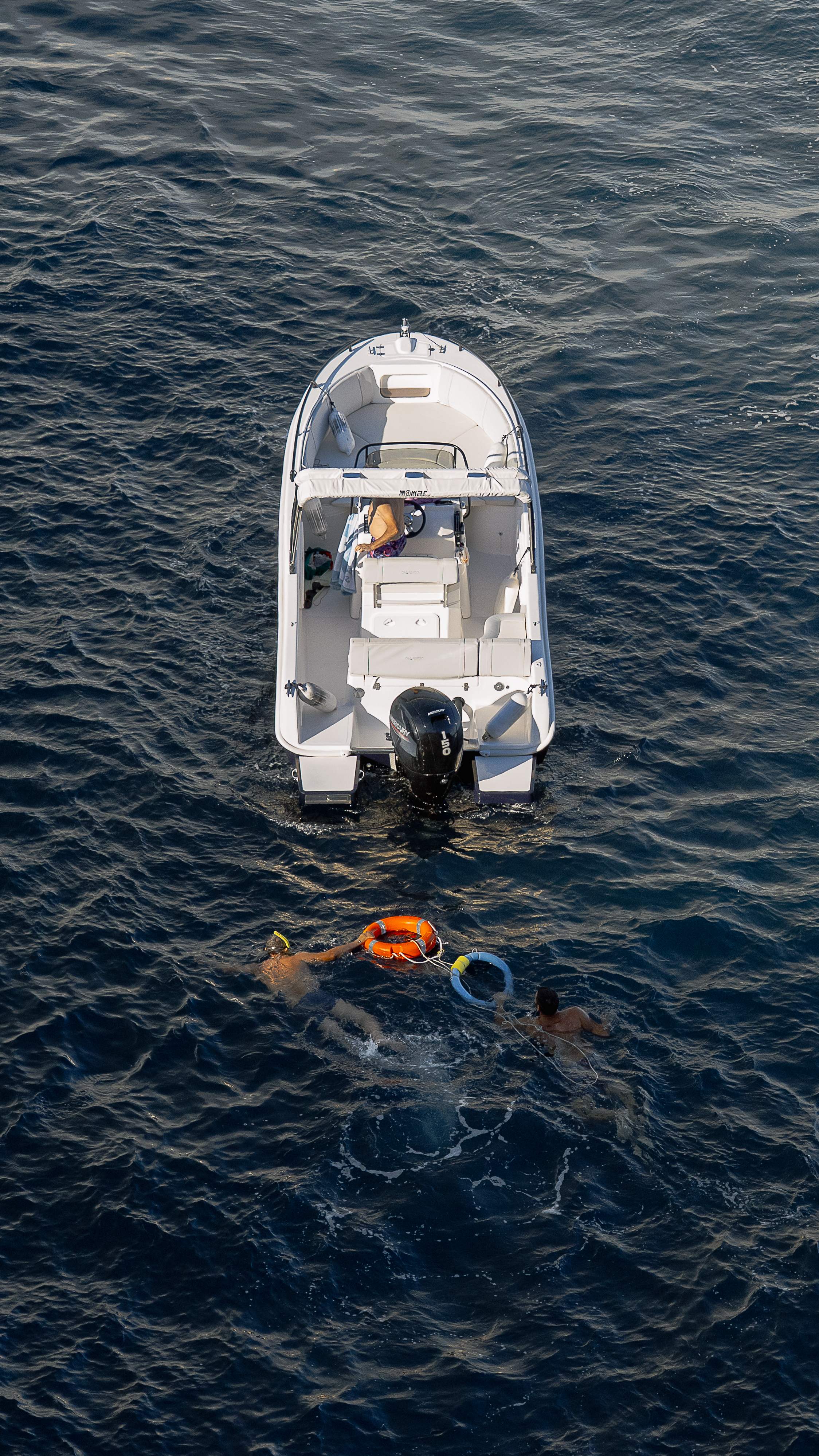 Aerial view of boat and swimmers